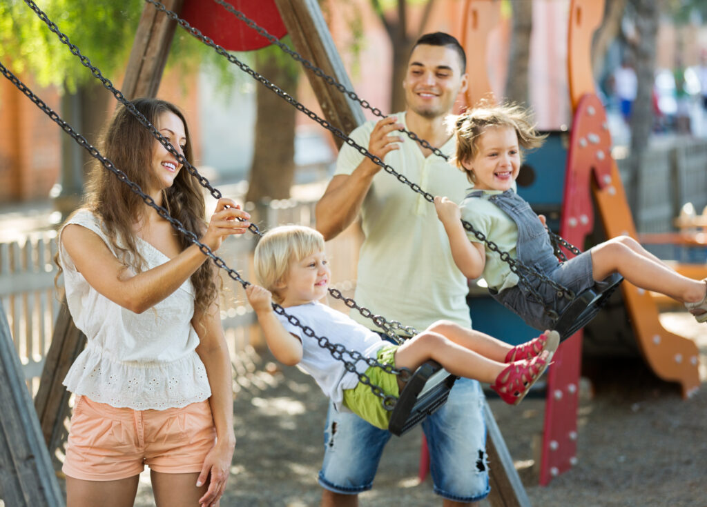Family enjoying active outdoor play together
